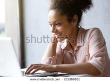 women sitting at a computer