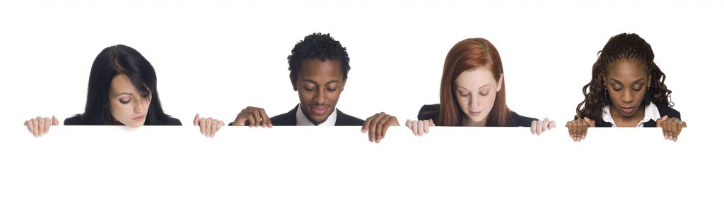 row of people looking over a ledge